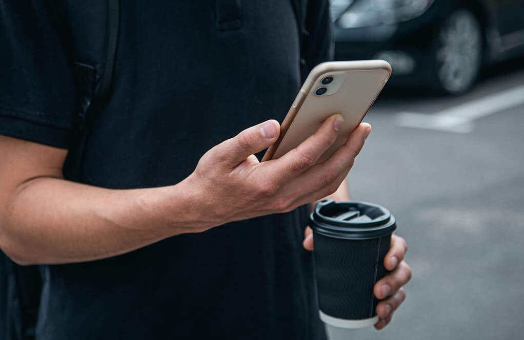 melbet-person-using-app-on-mobile-phone