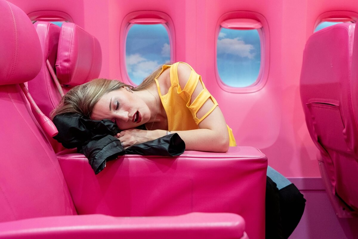 Tired Businesswoman sleeping in plane